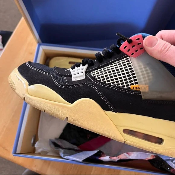 Air Jordan 4 Retro Low-Top in Black with Blue and Red Accents - Picture 7 of 11